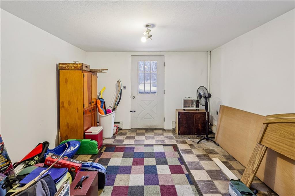 199 Anglers Rest Lane Utica, PA 16362 - Photo 27 of 49 a room with furniture and a rug