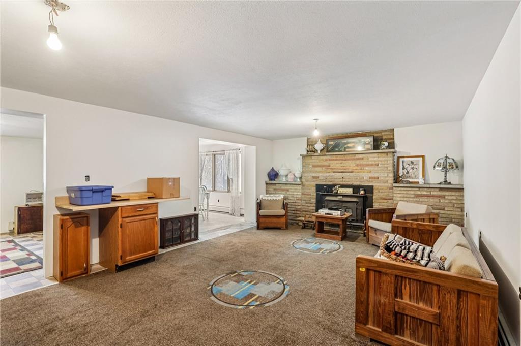 199 Anglers Rest Lane Utica, PA 16362 - Photo 30 of 49 a living room with furniture and a fireplace