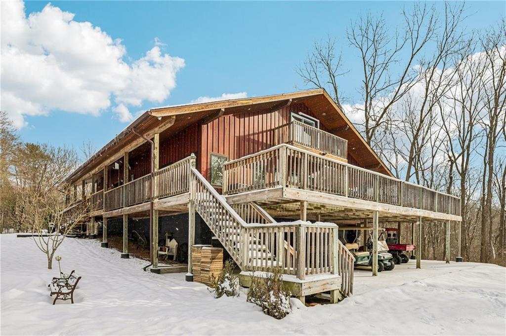 199 Anglers Rest Lane Utica, PA 16362 - Photo 4 of 49 a view of a house with a wooden deck