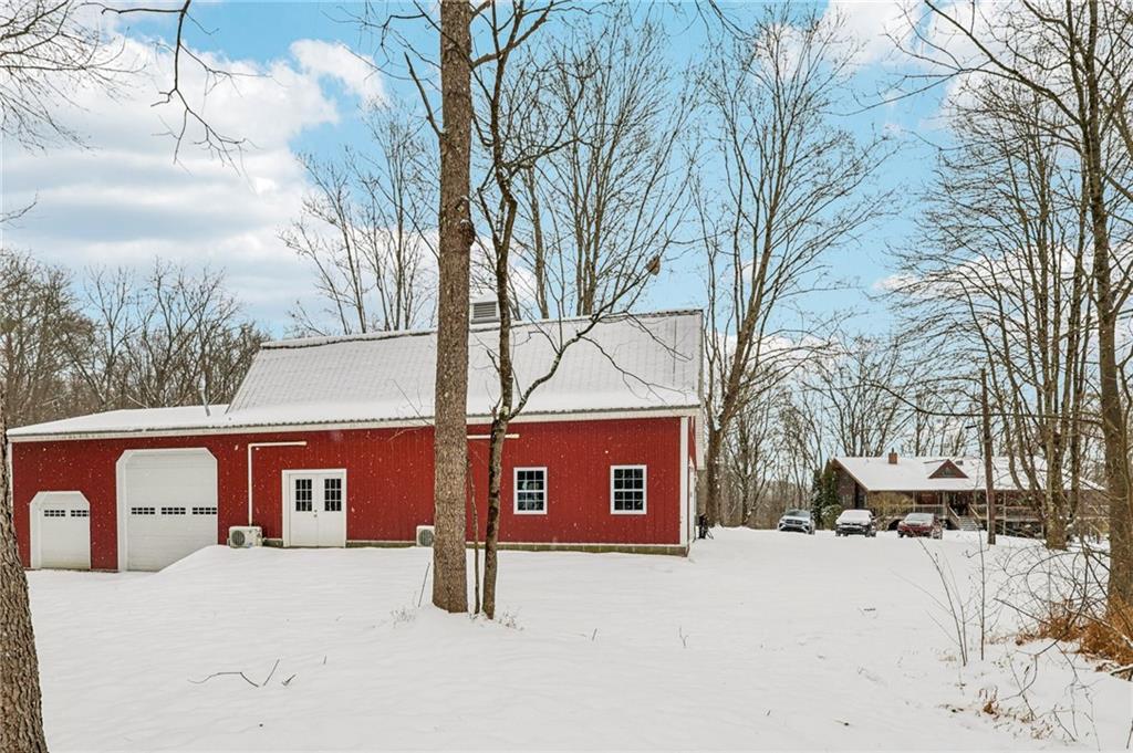 199 Anglers Rest Lane Utica, PA 16362 - Photo 44 of 49 a front view of a house with yard covered in snow
