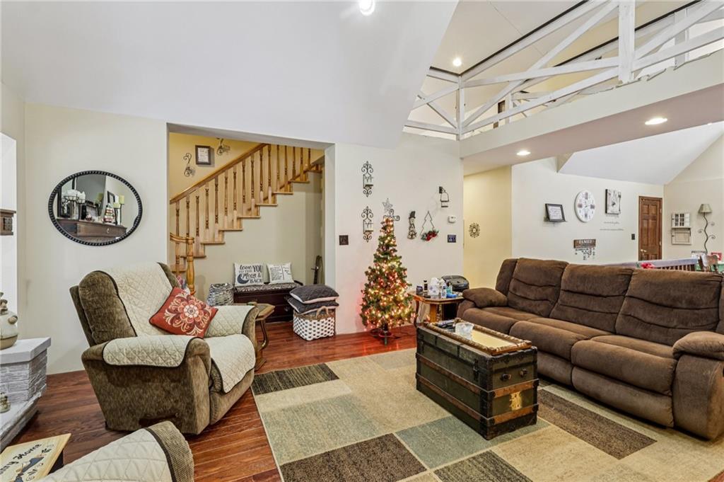 199 Anglers Rest Lane Utica, PA 16362 - Photo 10 of 49 a living room with furniture a clock on wall and a window