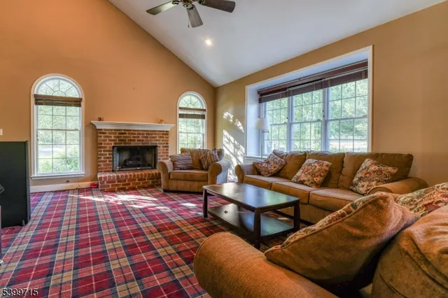 a living room with a couch and a fireplace