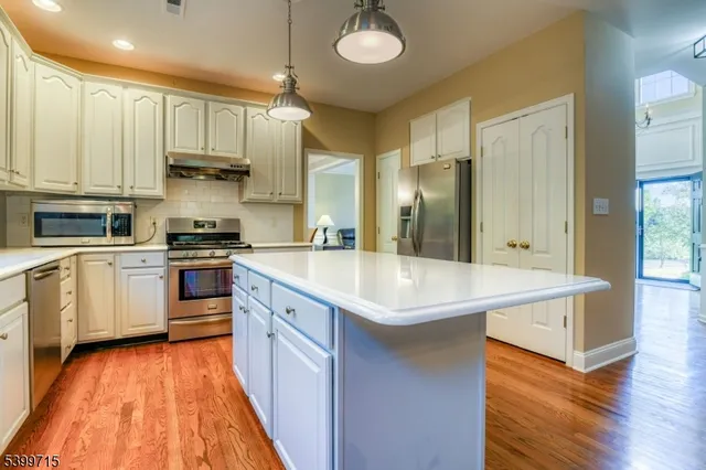 a kitchen with a sink and refrigerator