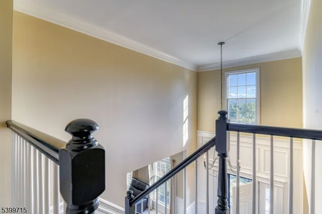 a view of a hallway to a window