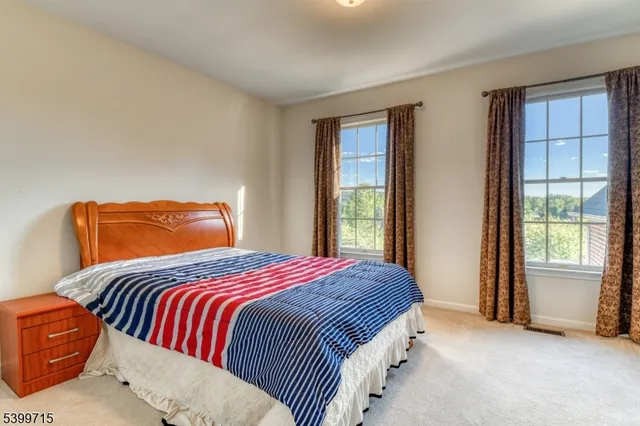 a bedroom with bed and window
