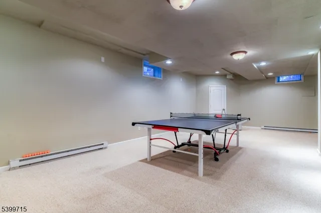 a room with furniture and a projector screen