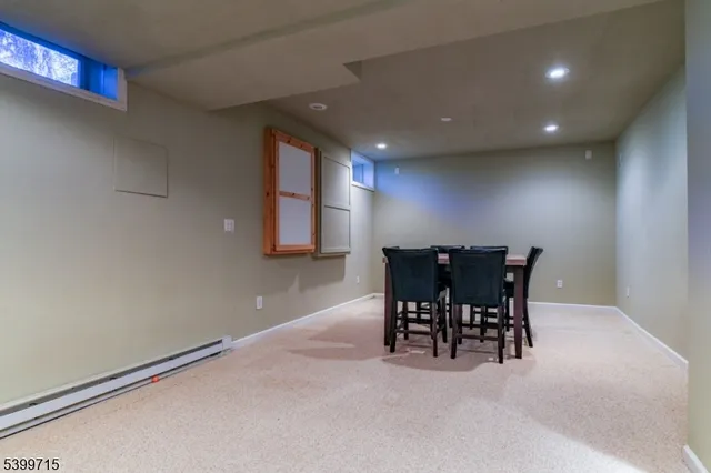 a view of a dining area with furniture and a potted plant