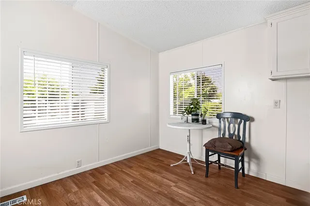 a view of a room with furniture window and wooden floor