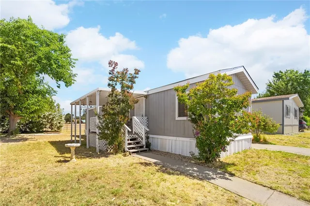 a view of a house with snow in the yard