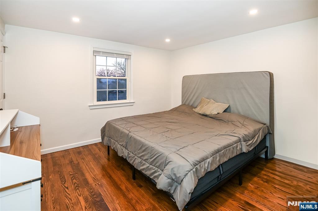 260 Kensington Road River Edge, NJ 07661 - Photo 13 of 22 a bedroom with a bed and wooden floor