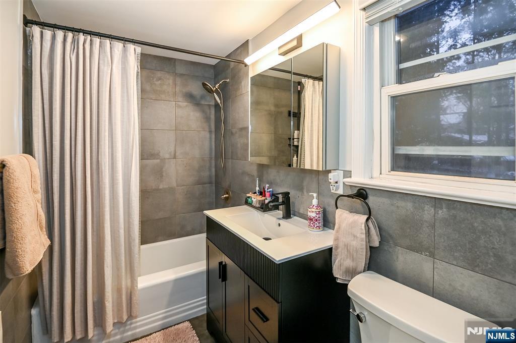 260 Kensington Road River Edge, NJ 07661 - Photo 15 of 22 a bathroom with a sink mirror vanity and toilet