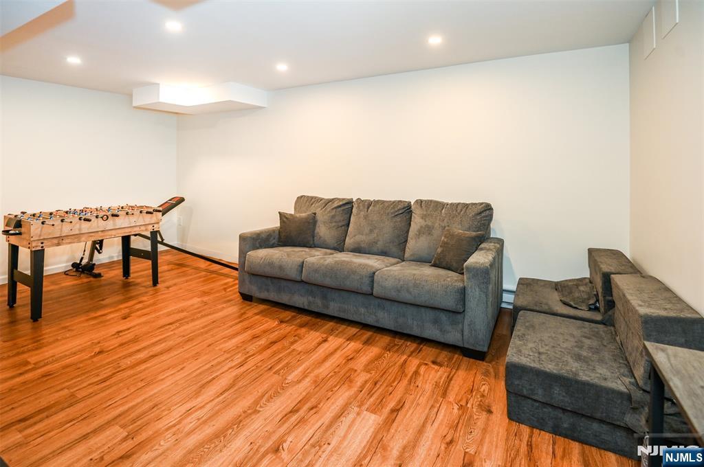 260 Kensington Road River Edge, NJ 07661 - Photo 17 of 22 a living room with furniture and a wooden floor