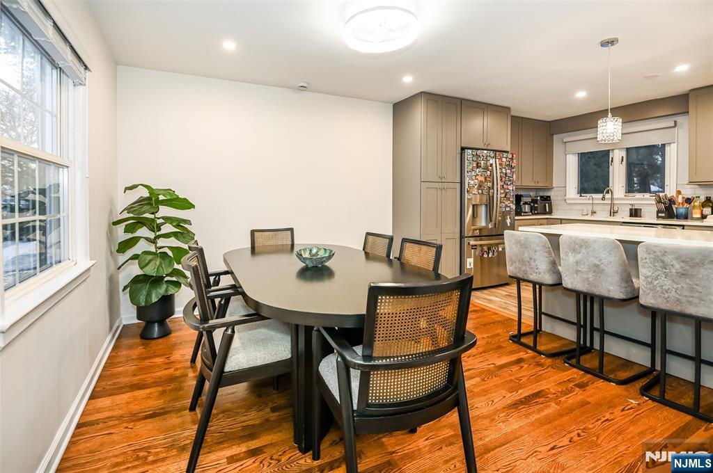 260 Kensington Road River Edge, NJ 07661 - Photo 5 of 22 a view of a dining room with furniture and a potted plant