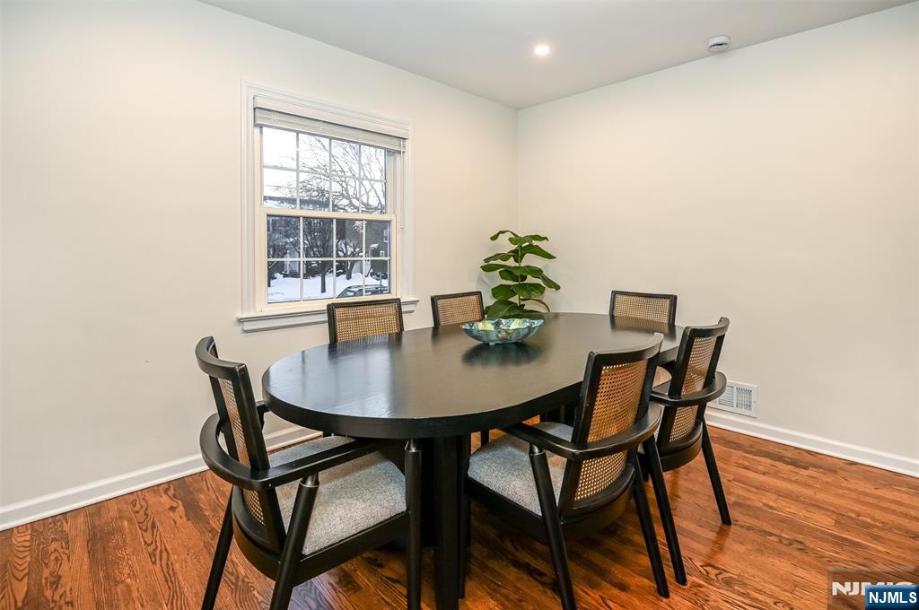 260 Kensington Road River Edge, NJ 07661 - Photo 6 of 22 a view of a dining room with furniture and wooden floor