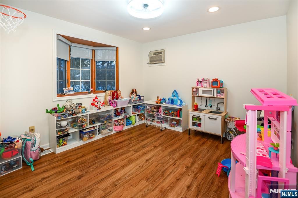 260 Kensington Road River Edge, NJ 07661 - Photo 10 of 22 a living room with lots of furniture and baby toys