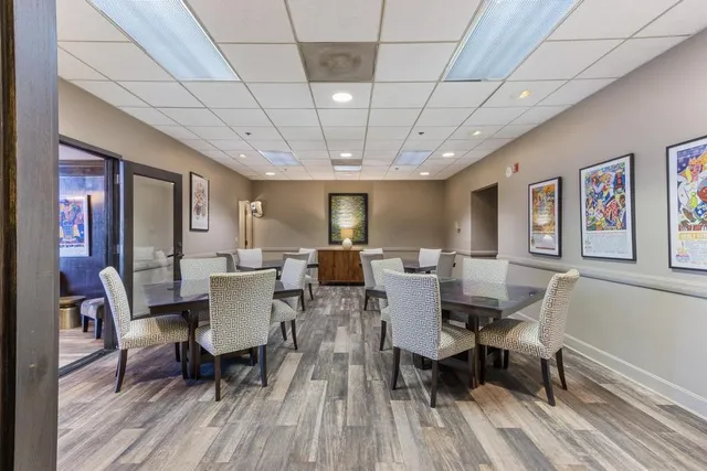 a large room with lots of counter space and windows