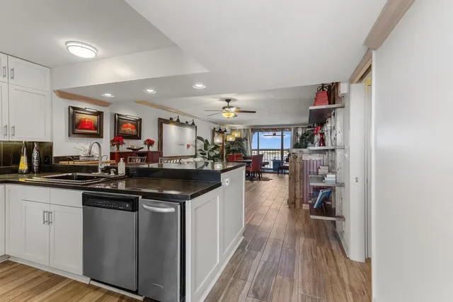 a kitchen with stainless steel appliances granite countertop a lot of counter space and a sink
