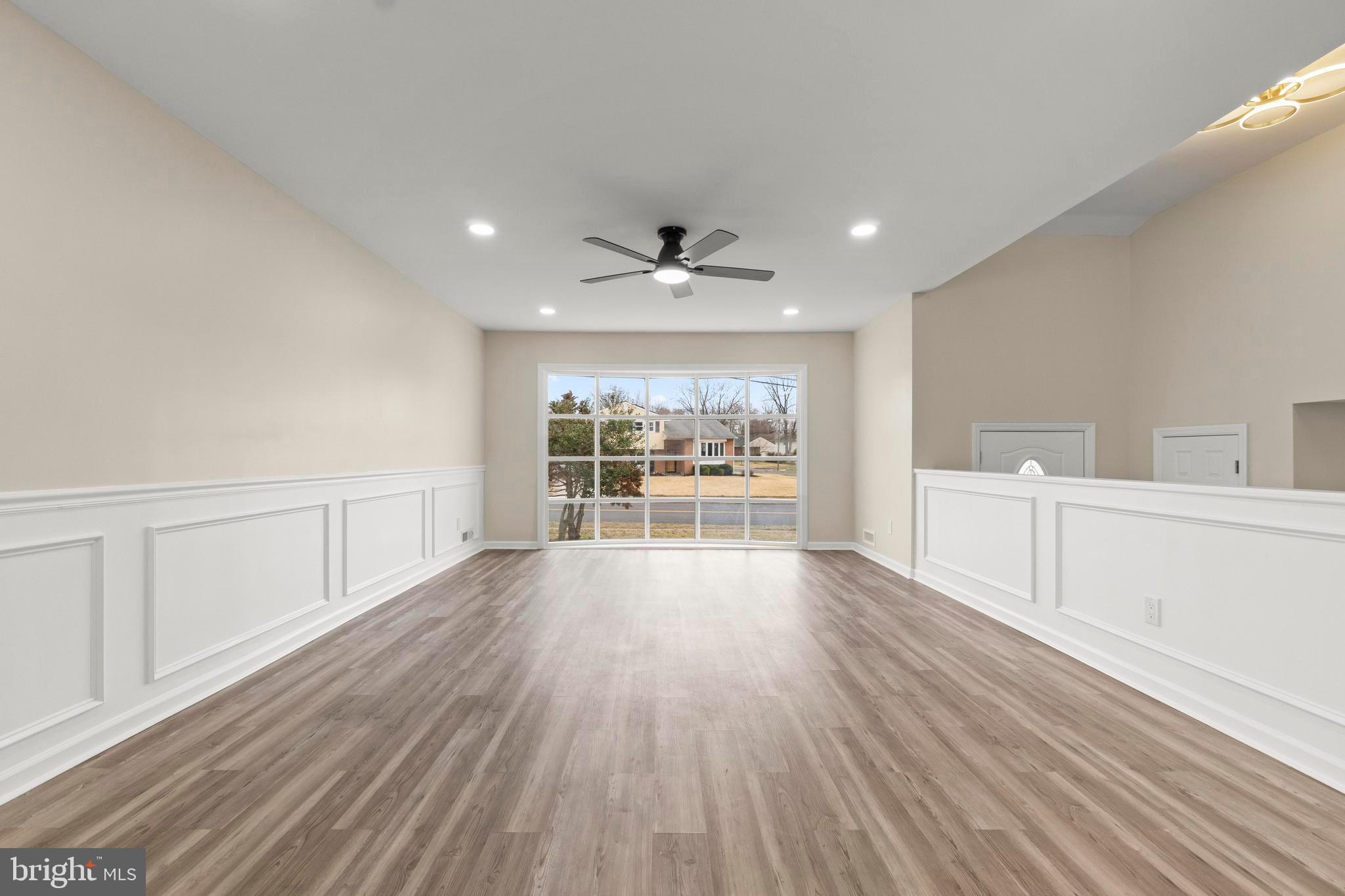 998 Kingston Drive Cherry Hill, NJ 08034 - Photo 12 of 35 a view of an empty room with a window and wooden floor