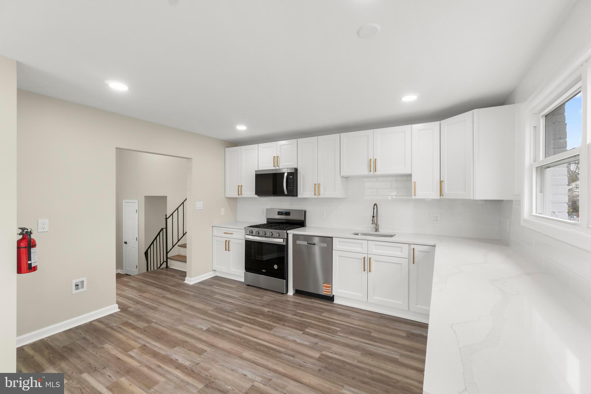 998 Kingston Drive Cherry Hill, NJ 08034 - Photo 18 of 35 a kitchen with stainless steel appliances granite countertop a stove and a refrigerator