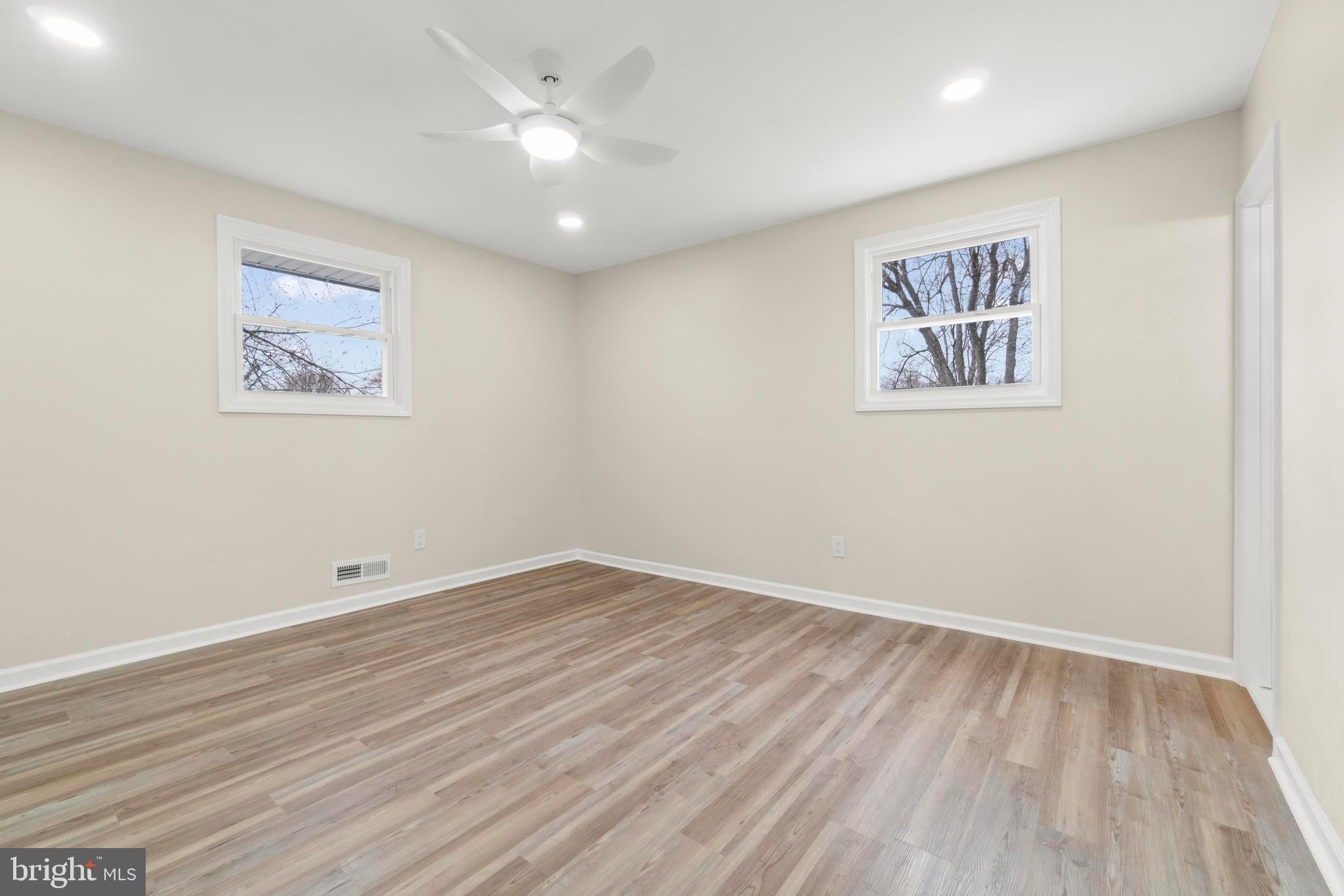 998 Kingston Drive Cherry Hill, NJ 08034 - Photo 25 of 35 a view of an empty room with wooden floor