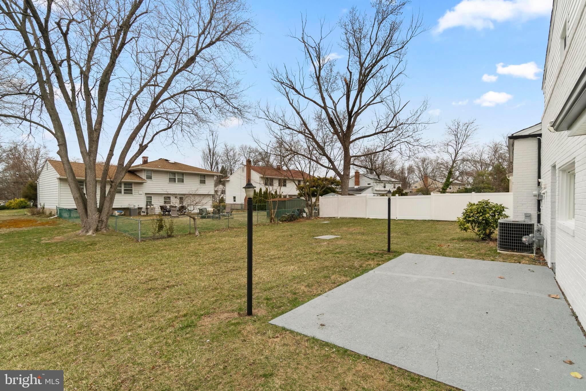 998 Kingston Drive Cherry Hill, NJ 08034 - Photo 30 of 35 a view of a street with a tree on the side of it