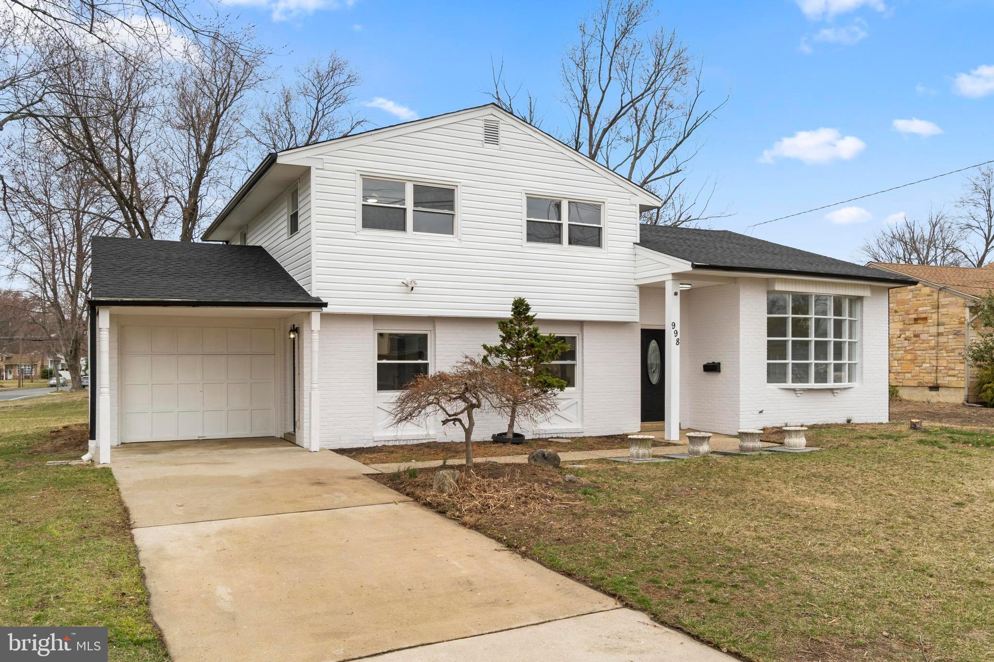998 Kingston Drive Cherry Hill, NJ 08034 - Photo 4 of 35 a front view of a house with a yard