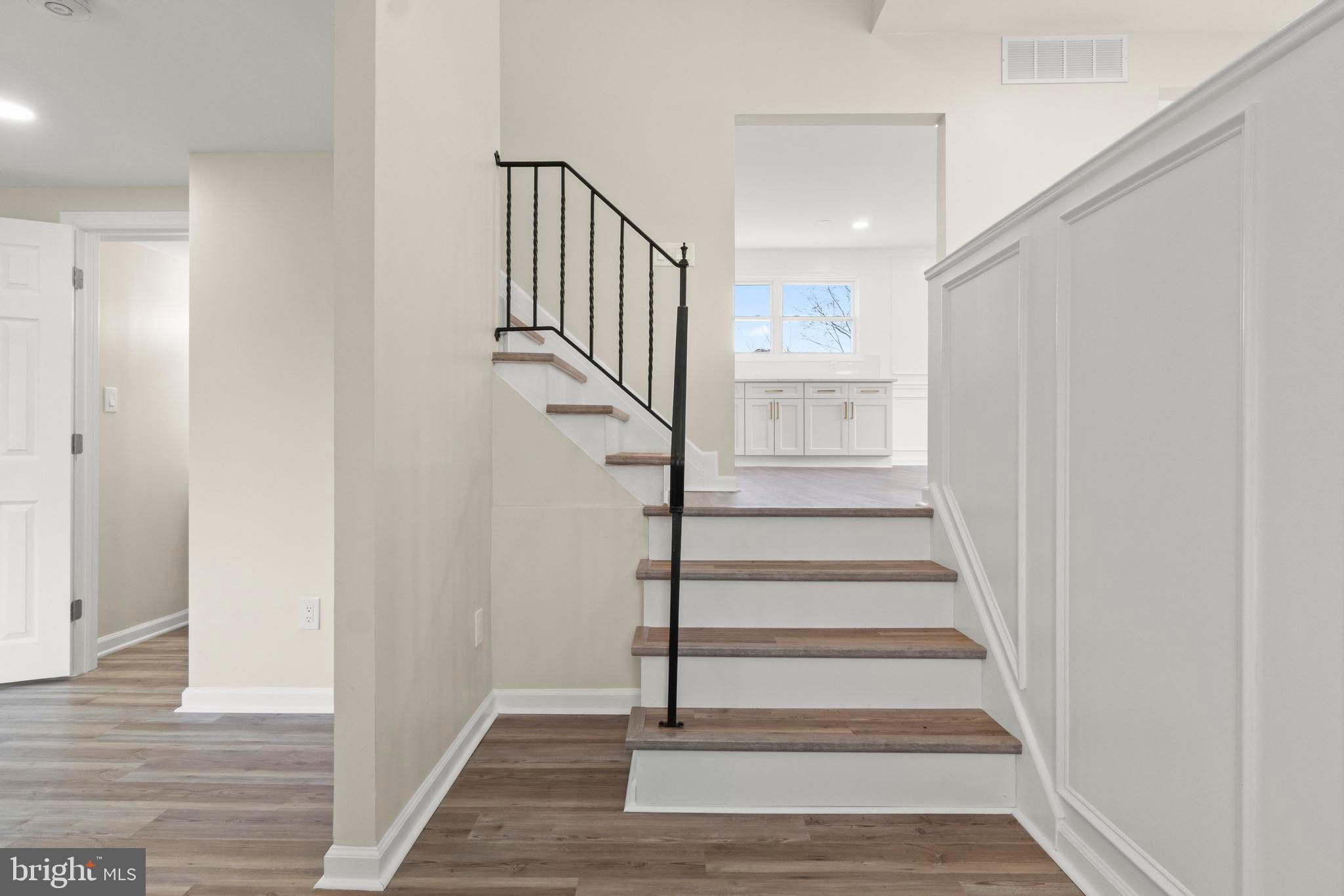 998 Kingston Drive Cherry Hill, NJ 08034 - Photo 5 of 35 a view of staircase with wooden floor and white walls