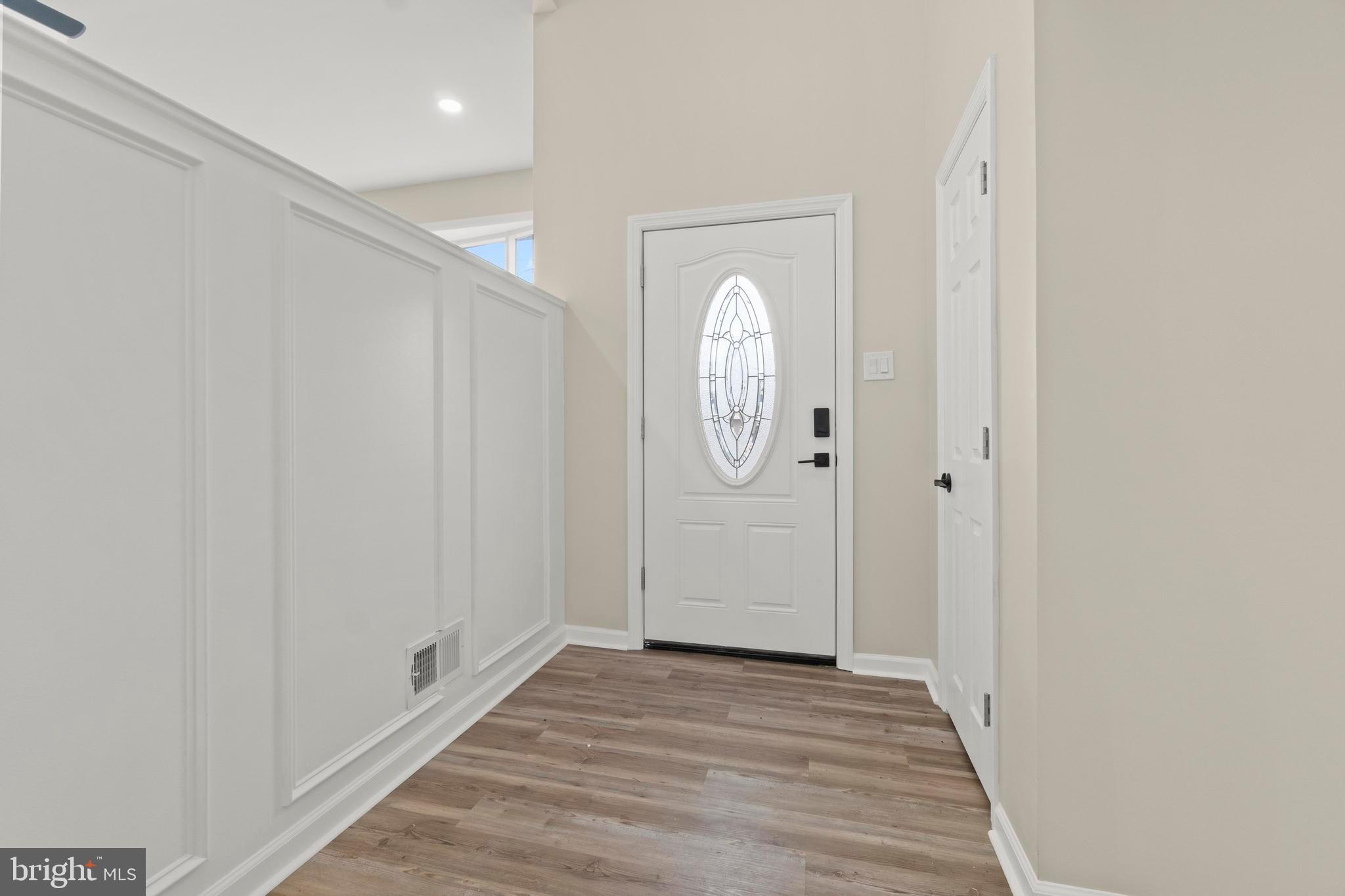 998 Kingston Drive Cherry Hill, NJ 08034 - Photo 6 of 35 a view of a hallway with wooden floor