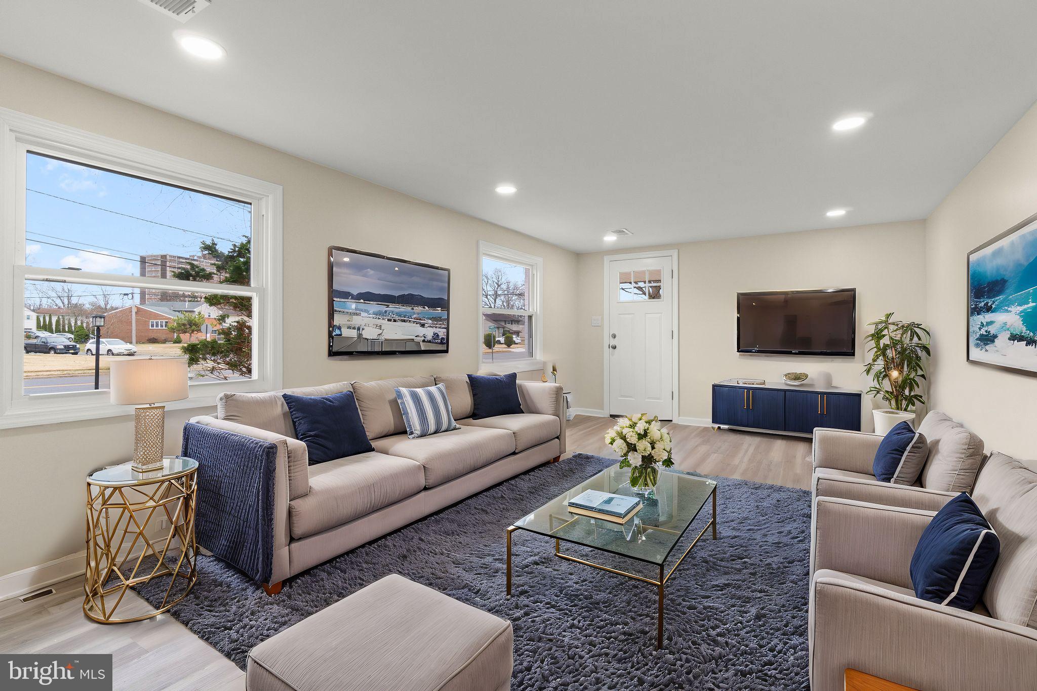 998 Kingston Drive Cherry Hill, NJ 08034 - Photo 8 of 35 a living room with furniture and a flat screen tv
