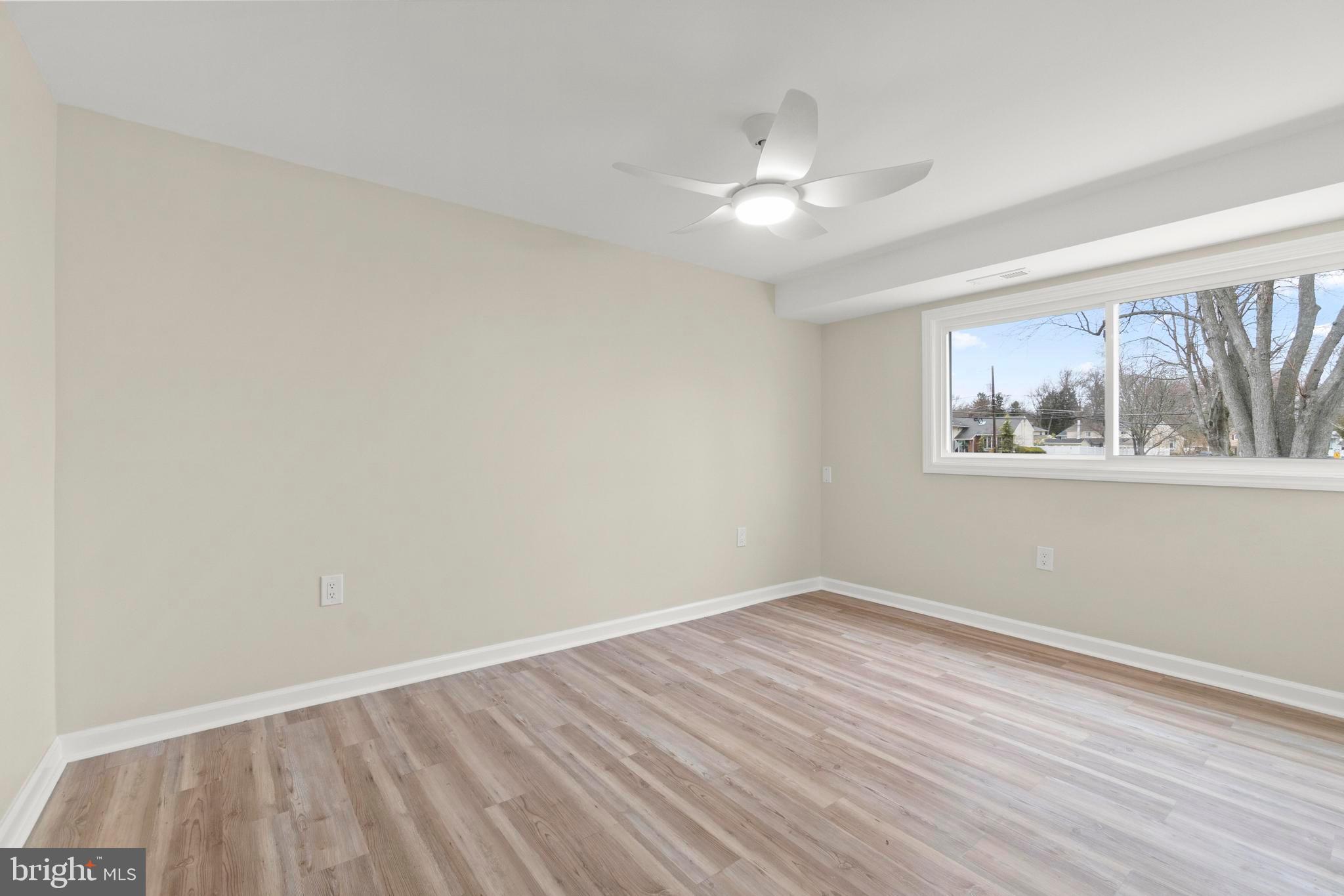 998 Kingston Drive Cherry Hill, NJ 08034 - Photo 10 of 35 a view of empty room with wooden floor and fan
