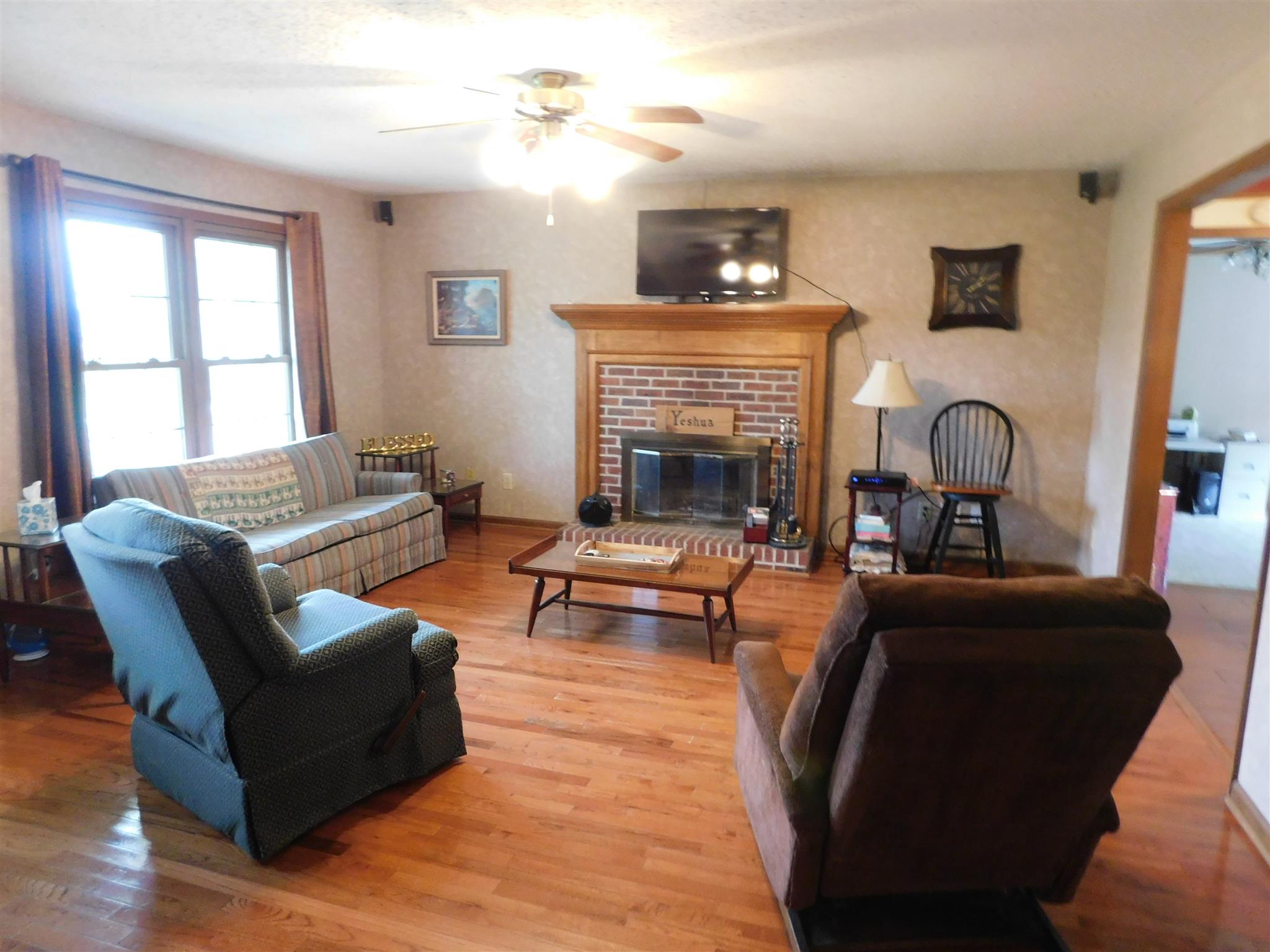 2495 Zion Road Columbia, TN 38401 - Photo 2 of 16 Living Room has hardwood floors and brick fireplace.
