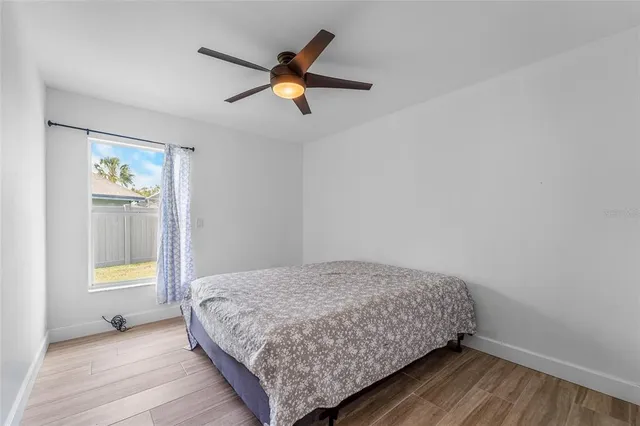 a bedroom with a bed and a table