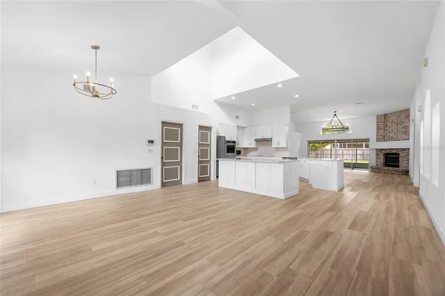 a view of kitchen with wooden floor and window