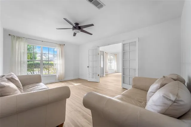a living room with furniture and a window