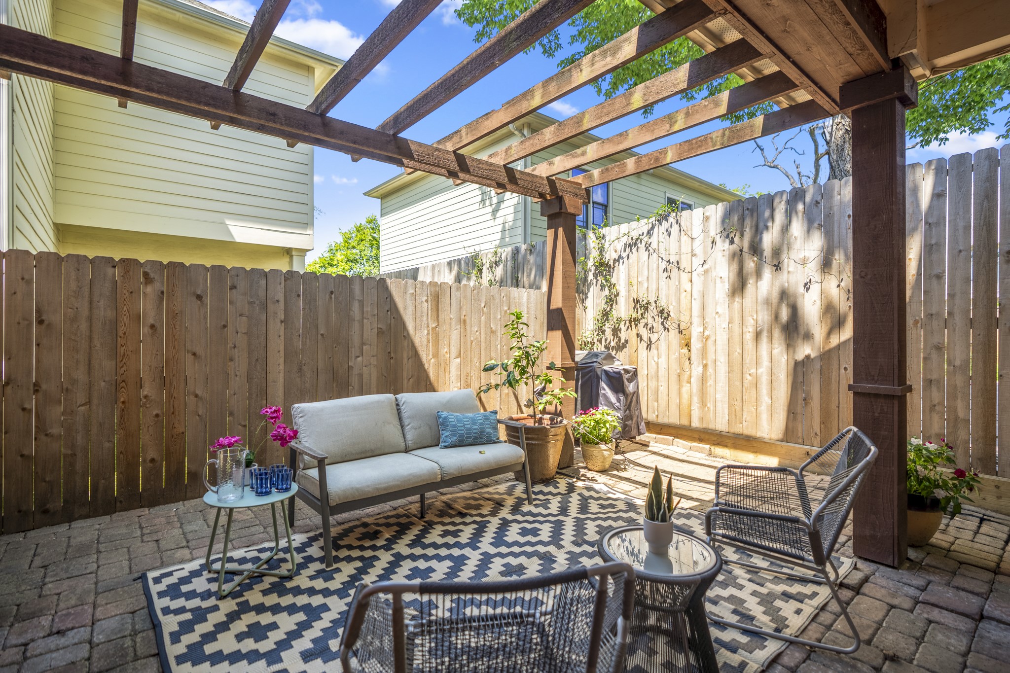 905 West 23rd Street Houston, TX 77008 - Photo 4 of 46 Covered pergola and private outdoor space extend everyday living beyond the interior, offering a rare backyard setting in Shady Acres.