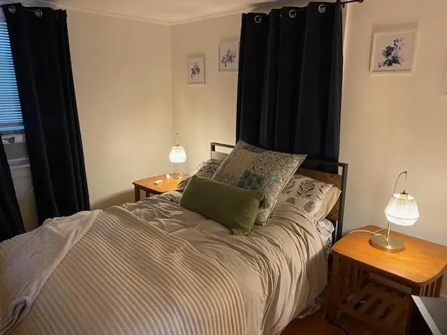 a bedroom with a bed and a table in it