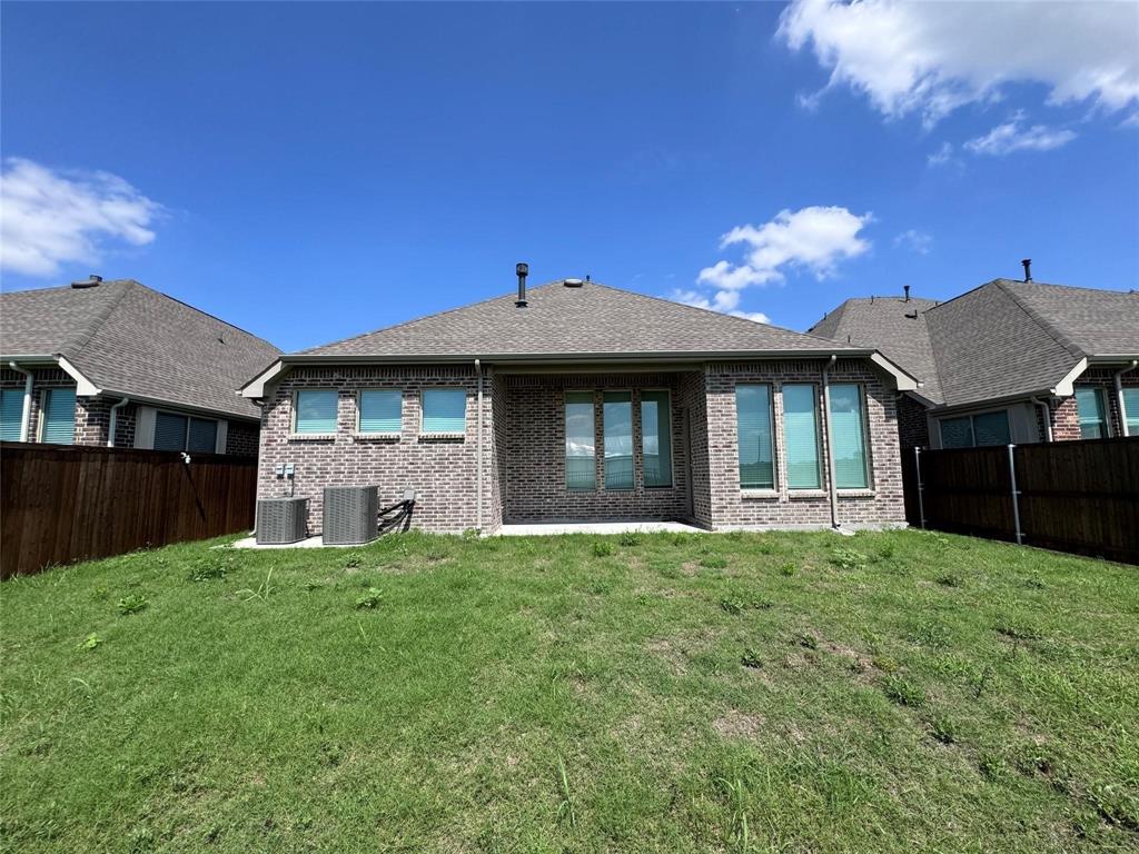 17305 Texas Pistache Drive Dallas, TX 75252 - Photo 12 of 13 a front view of a house with a yard