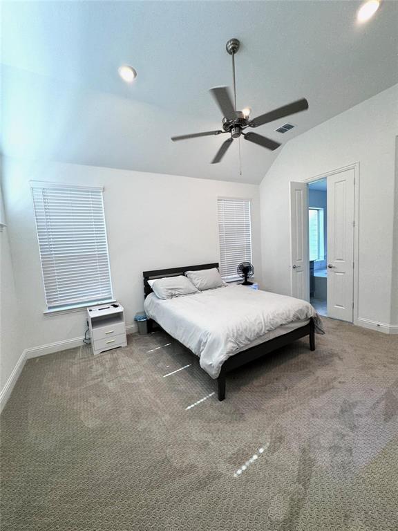 17305 Texas Pistache Drive Dallas, TX 75252 - Photo 9 of 13 a bedroom with a bed and a ceiling fan