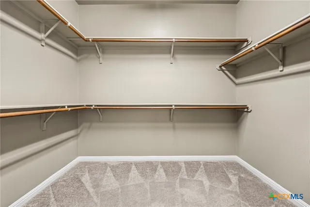 a view of a hallway with a window