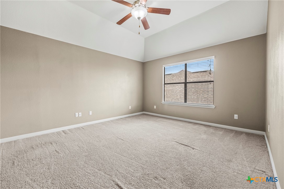 3306 Castleton Drive Killeen, TX 76542 - Photo 23 of 39 an empty room with windows and ceiling fan