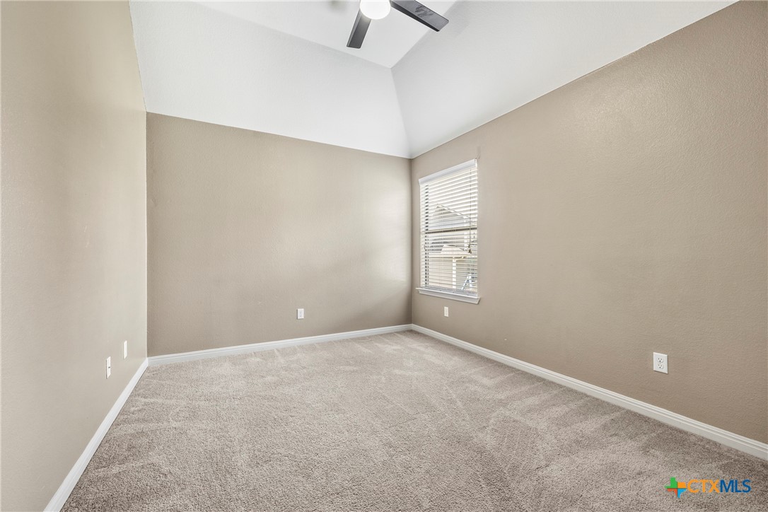 3306 Castleton Drive Killeen, TX 76542 - Photo 30 of 39 an empty room with windows and ceiling fan