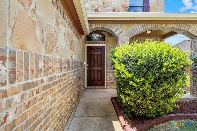 a house with yard in front of it