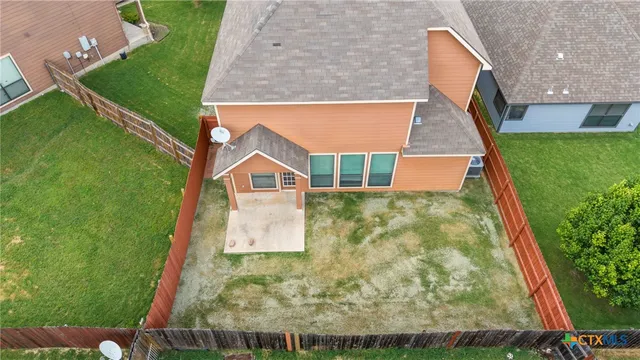 an aerial view of a house with a garden