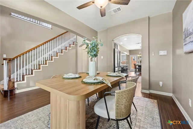 a view of a dining room with furniture window and wooden floor