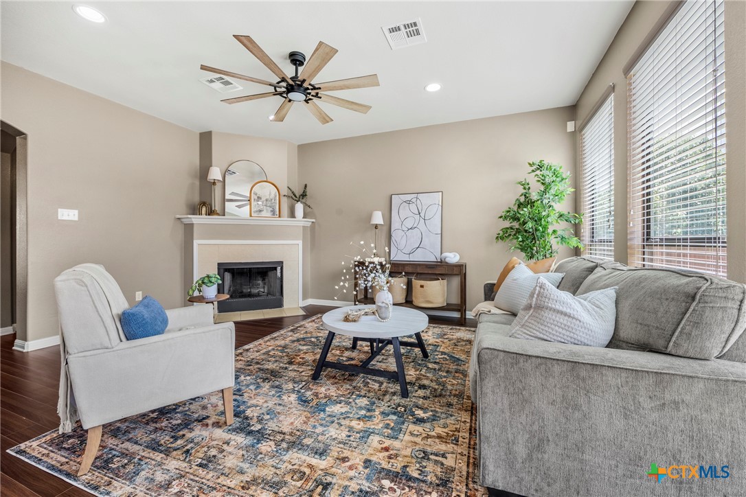 3306 Castleton Drive Killeen, TX 76542 - Photo 7 of 39 a living room with furniture and a fireplace