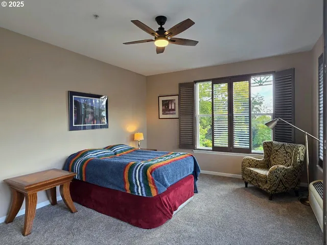 a bedroom with a bed and a couch