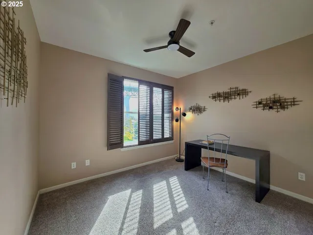 a living room with furniture and windows