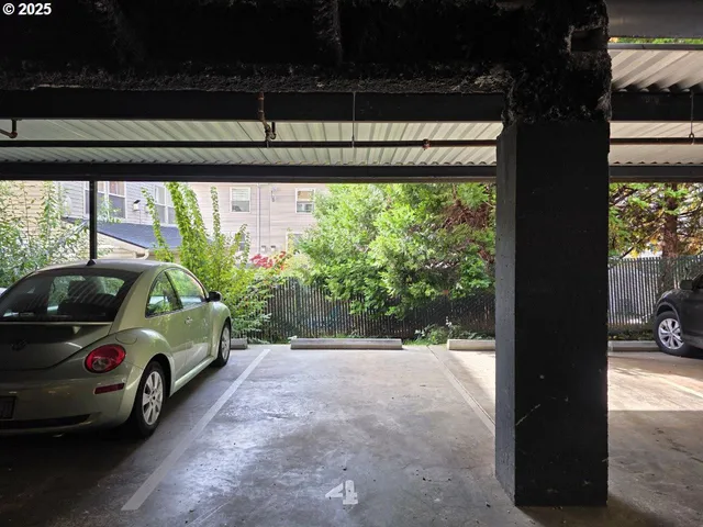 a view of a car in front of a building