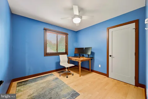a kitchen with a table chairs and a window