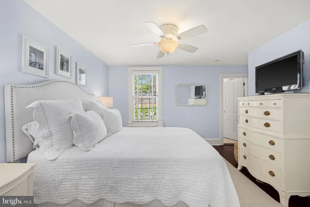 a large white bed in a white room